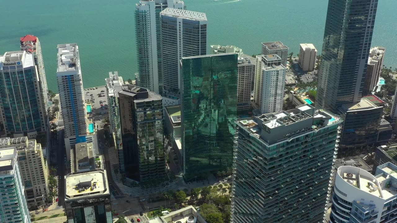 Aerial view over the Brickell financial district and Biscayne Bay — home of Ibis SaaS Holdings at Brickell Arch